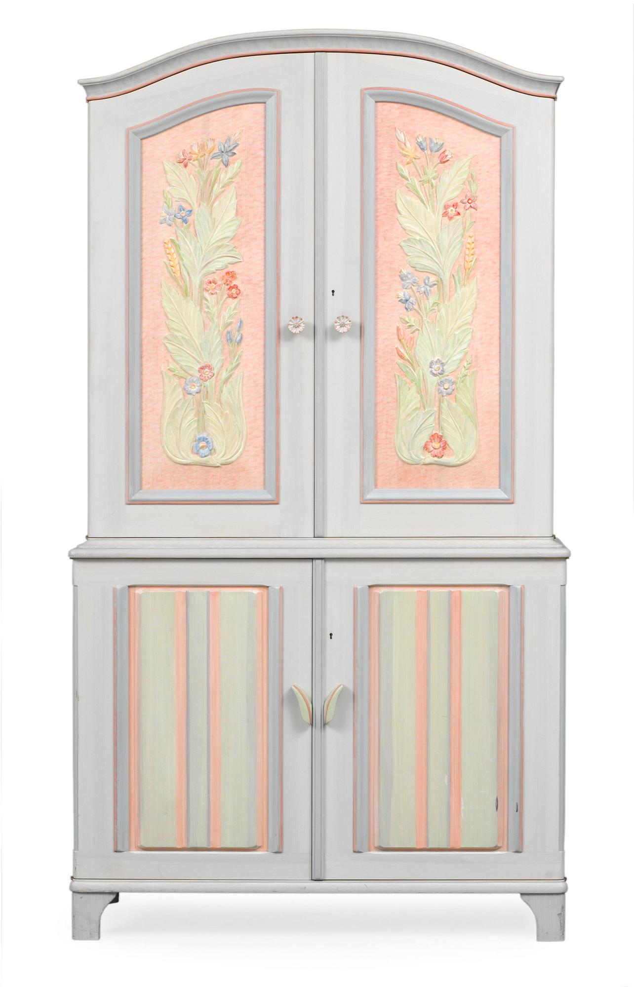 A Carl Malmsten cabinet, "Stigberget", with carved and painted decoration of flowers in colours.