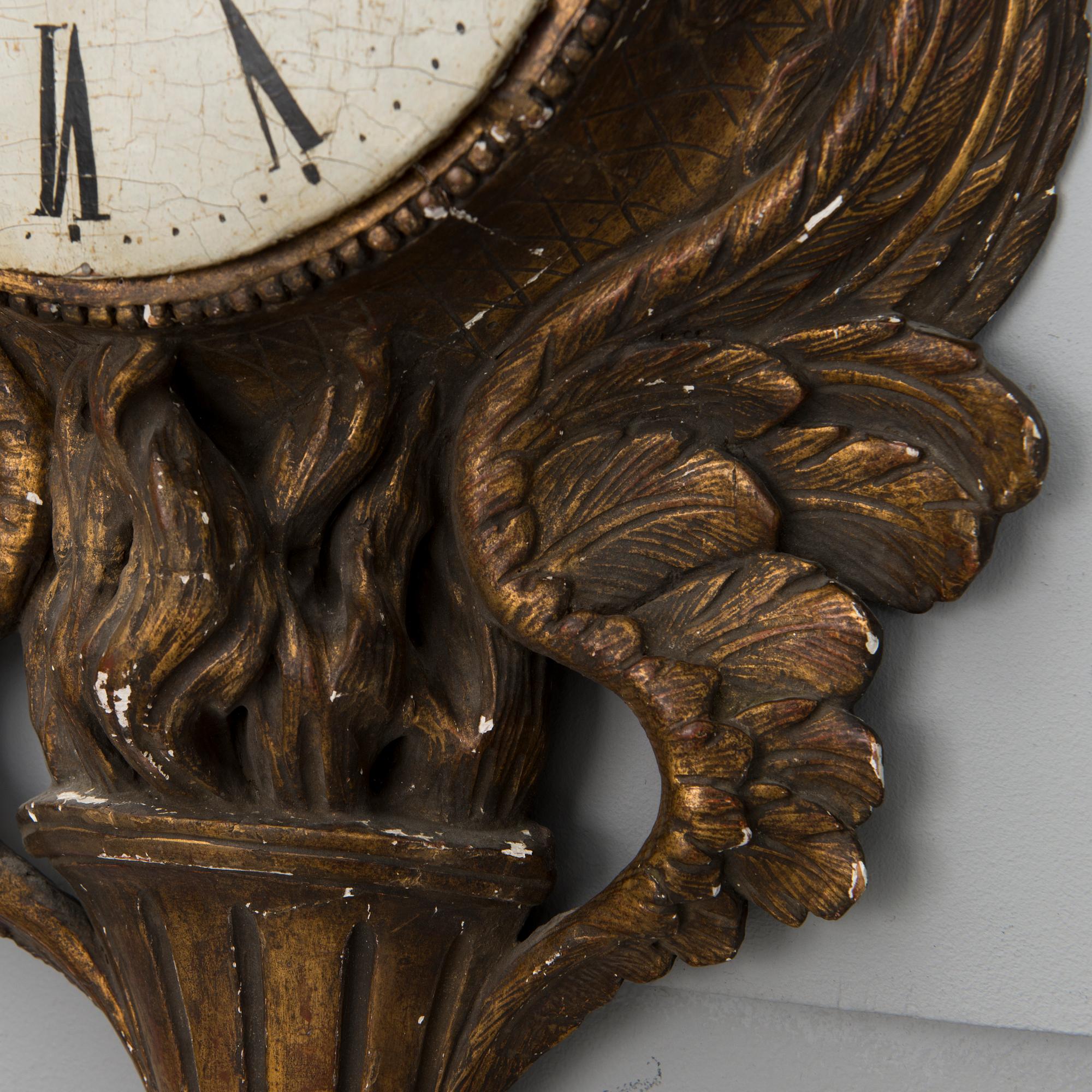 A 18th century wall clock.