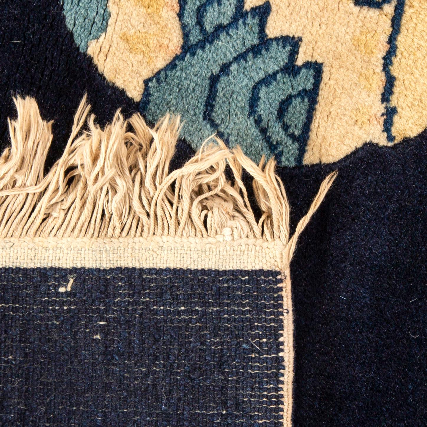 A semiantique Chinese Baotou carpet ca 140x70 cm.