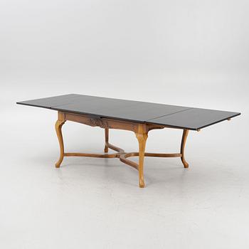 A Baroque style dining table , L.J. Larssons snickeriaffär, Mariefred, early 20th Century.