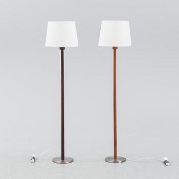 Uno & Östen Kristiansson, a pair of rosewood veneered floor lights, Luxus, Vittsjö, 1960's.