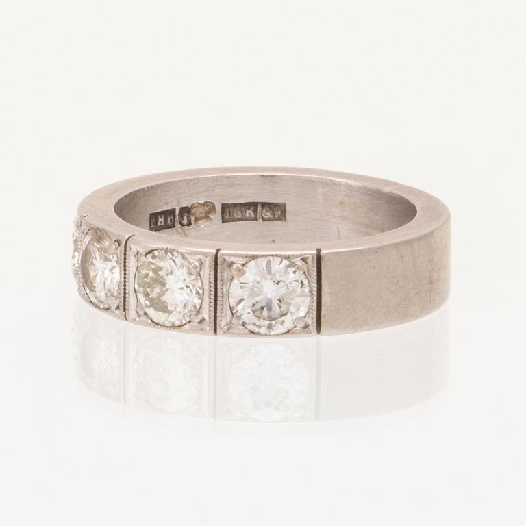 An 18K half eternity ring set with round brilliant cut diamonds by Bodens Guldatelje Johanneshov 1968.