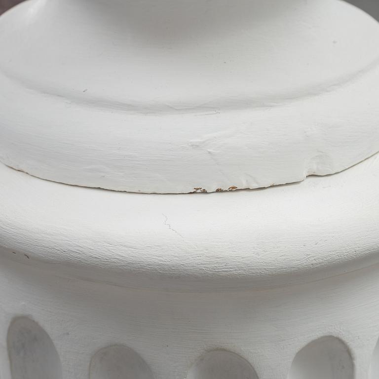 A plaster bust and pedestal.