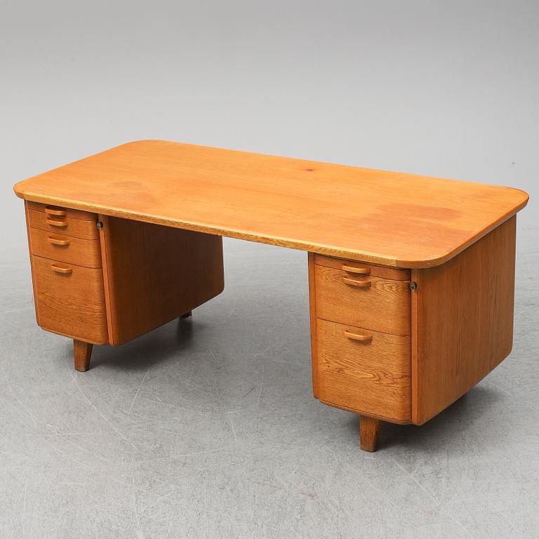 A 1950/60's oak writing desk.
