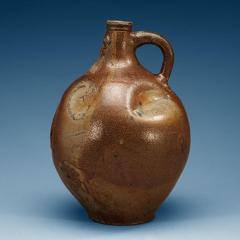 A large salt-glazed stoneware 'Bartman jug', 17th Century.