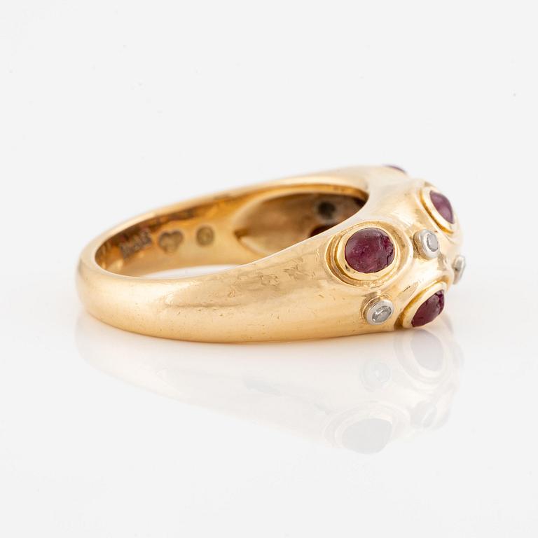 A W.A. Bolin ring in 18K gold with cabochon-cut rubies and eight-cut diamonds.