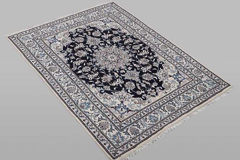 A rug, Nain, part silk, ca 198 x 144 cm.