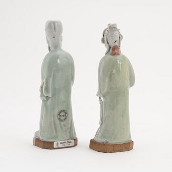 Two celadon glazed porcelain figurines of immortals, China, Qing dynasty, 18th Century.