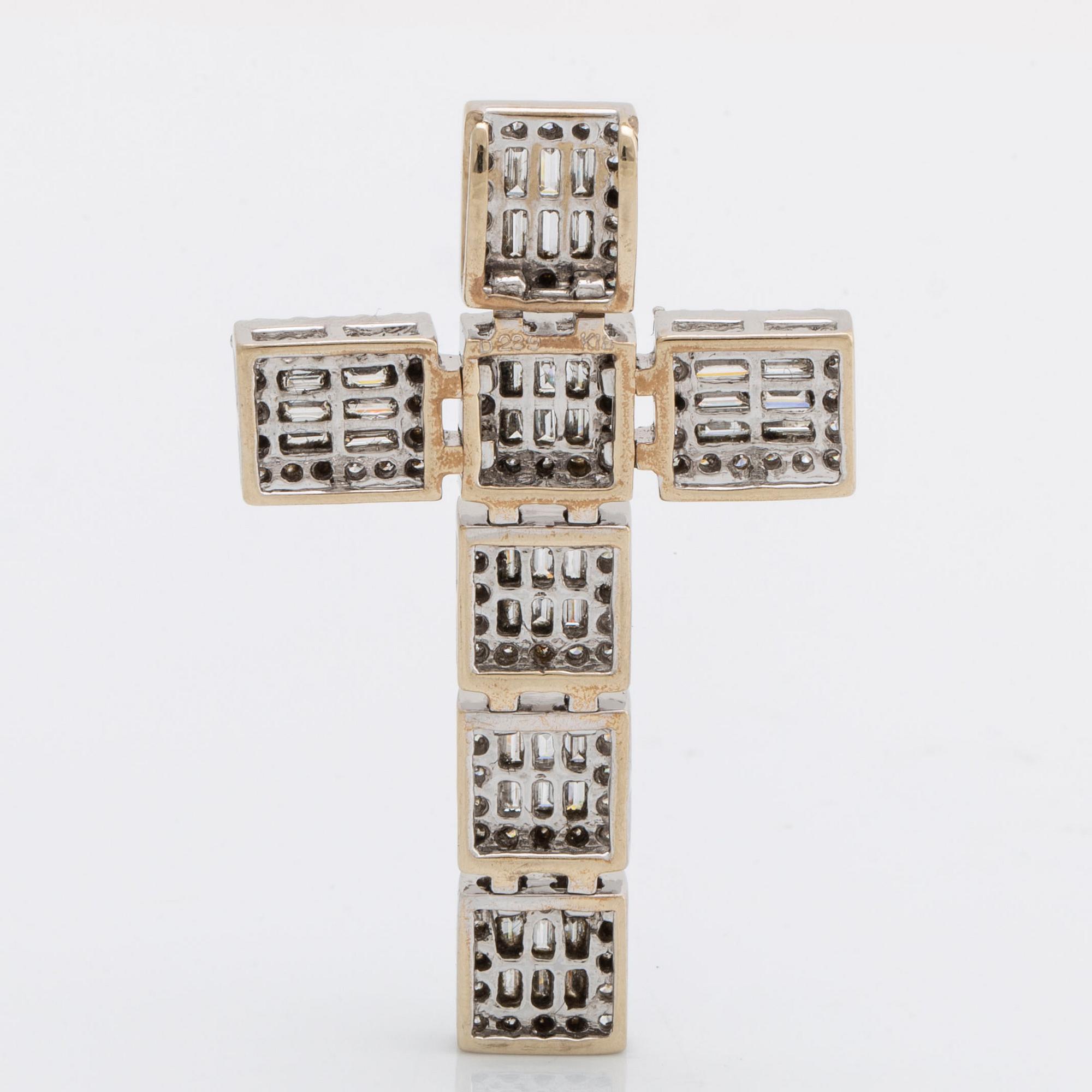 Diamantkors, 18K vitguld med briljanter och baguetter total vikt 2,89 ct enligt gravyr, ca 4,5 x 3 cm.