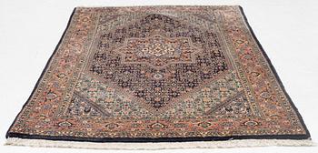 An oriental rug, approx. 203 x 135 cm.