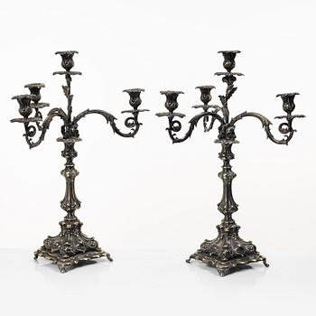 A pair of silver plated Rococo style candelabra, 20th century.