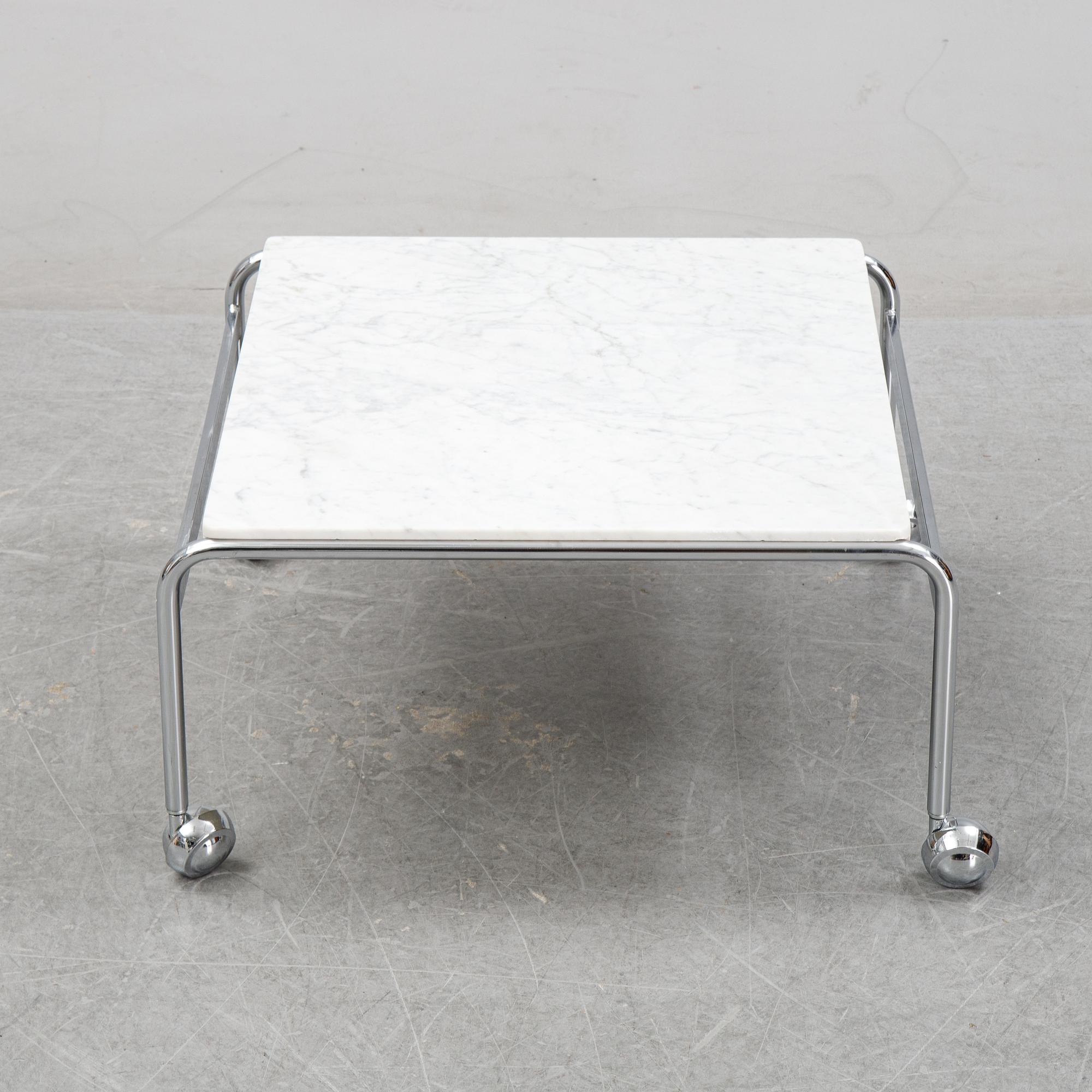 Bruno Mathsson, a pair of easy chairs and a coffee table, 'Karin', Dux, second half of the 20th Century.