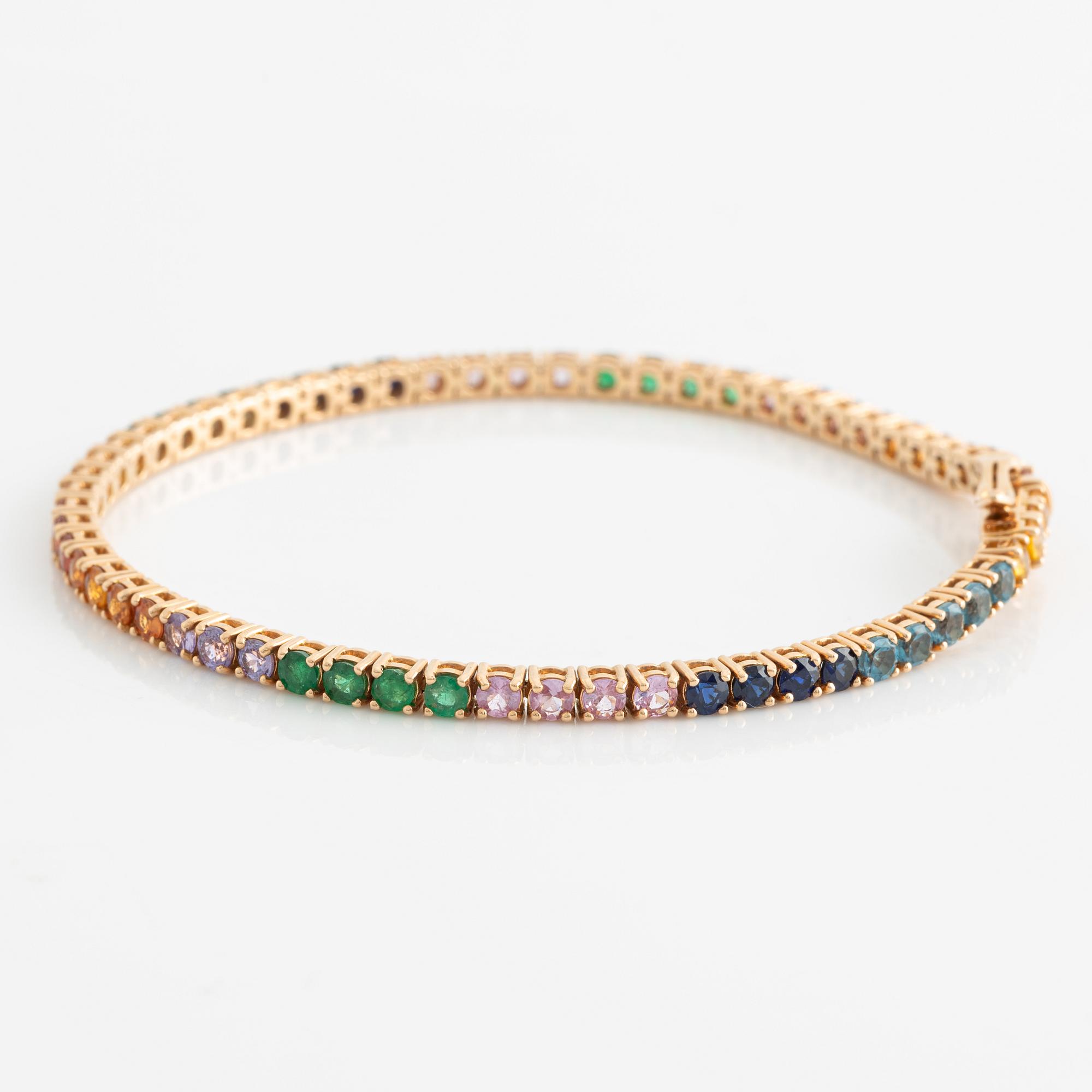 Bracelet 18K gold with faceted emeralds and sapphires in various colors.