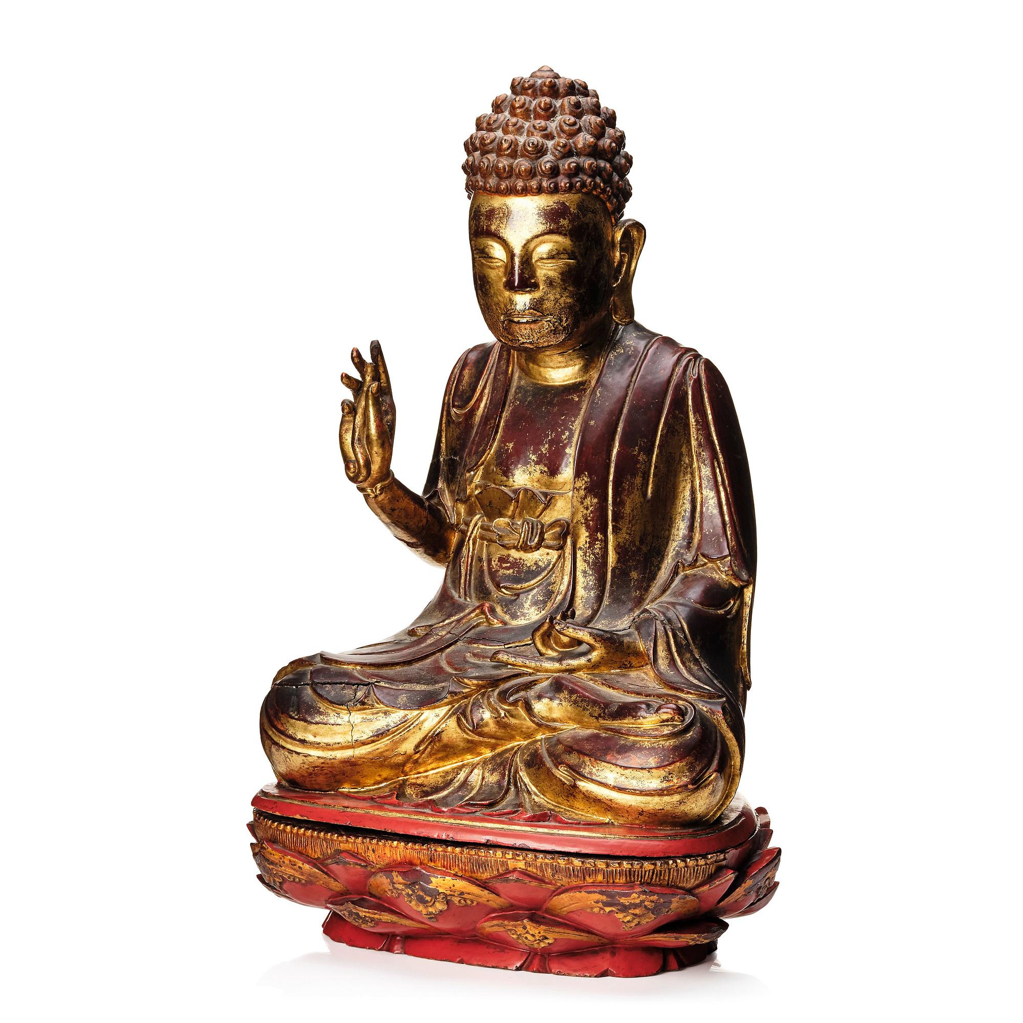 A large gilt and lacquered figure of a seated buddha, Qing dynasty, 19th Century.