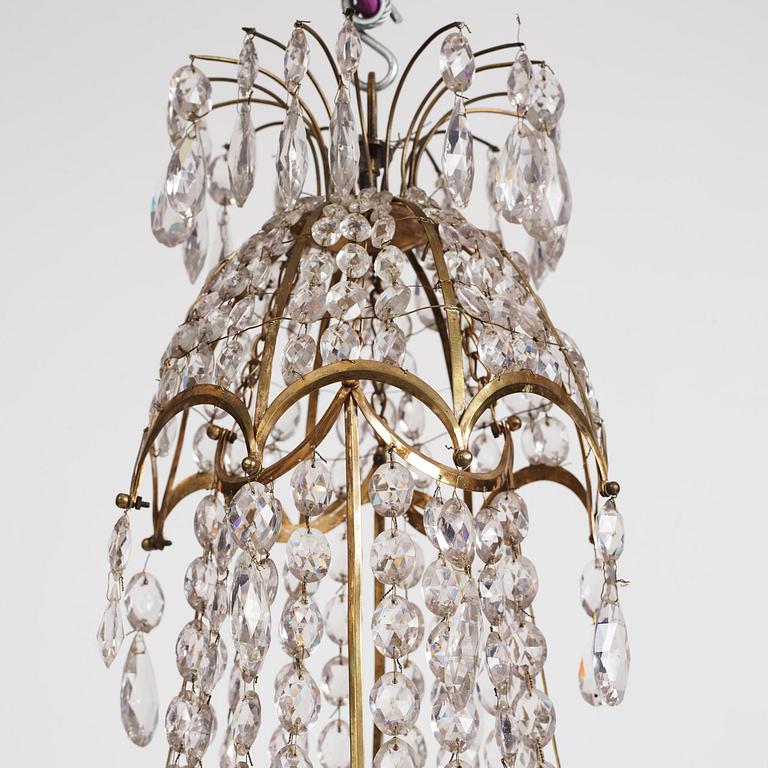 A late Gustavian gilt-brass and cut-glass five-light chandelier, Stockholm, late 18th century.