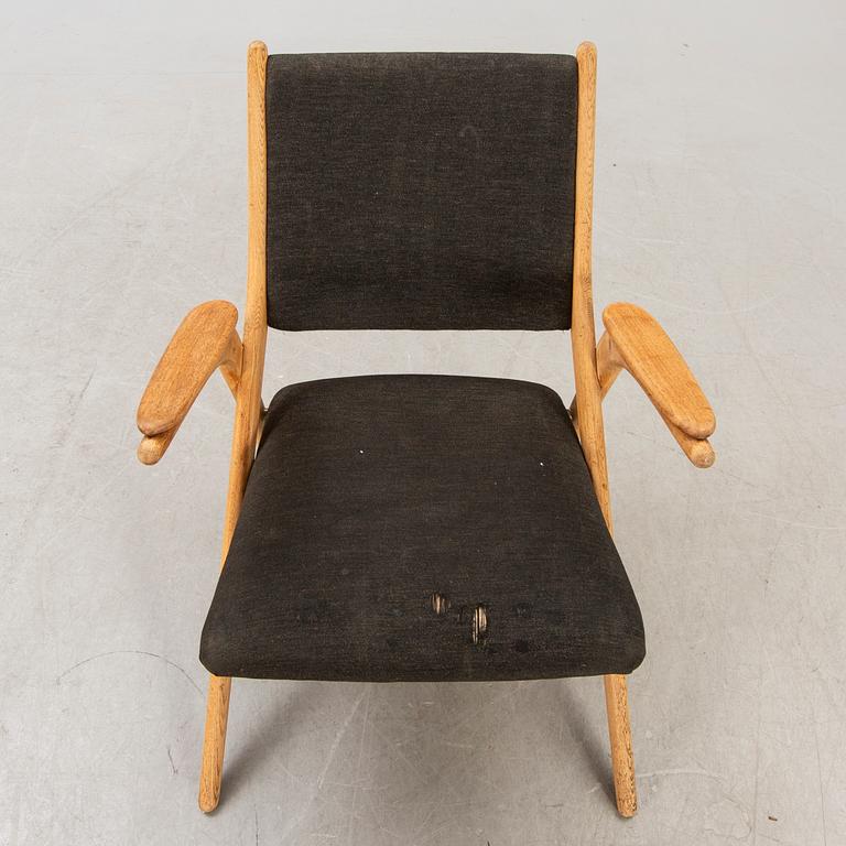 A Swedish oak and teak mid 1900s easy chair.