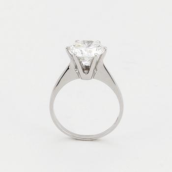 A SOLITAIRE RING set with a round brilliant-cut diamond.