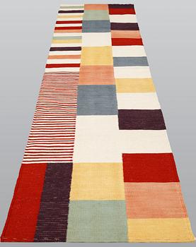 A carpet, flat weave, ca 292 x 80 cm.