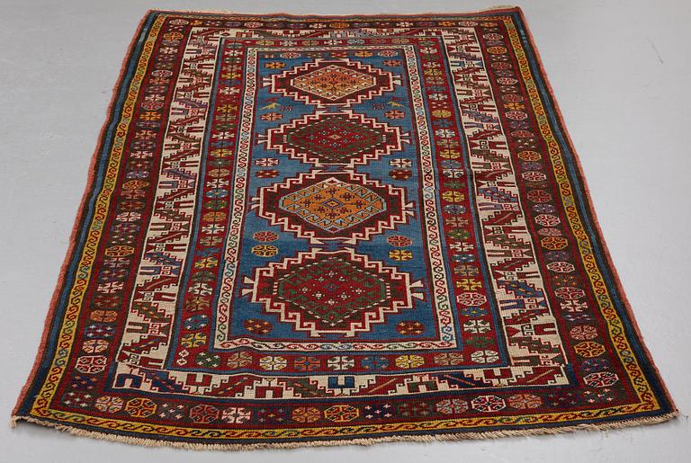 A RUG, a semi-antique Gendje probably, ca 209 x 124 cm.