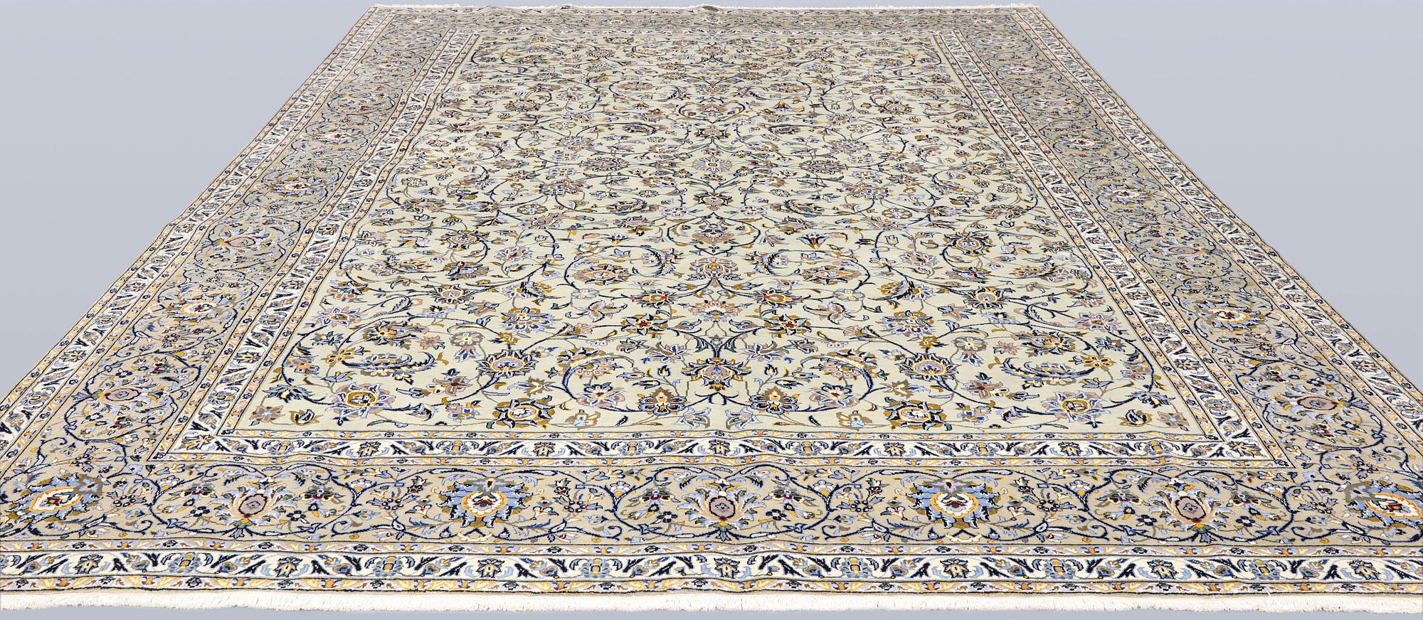 A Keshan carpet, signed, 397 x 302 cm.