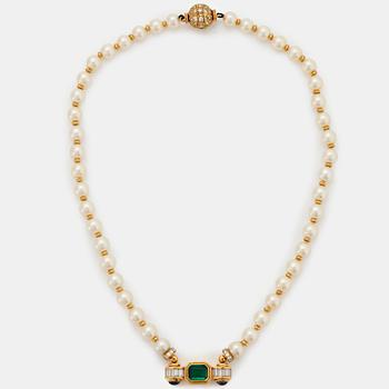 1033. A Bulgari cultured pearl necklace with an 18K gold plaque set with a faceted emerald.