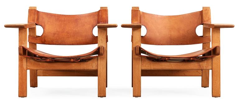 A pair of Børge Mogensen oak and leather 'Spanish Chair' by Fredericia Stolefabrik, Denmark.