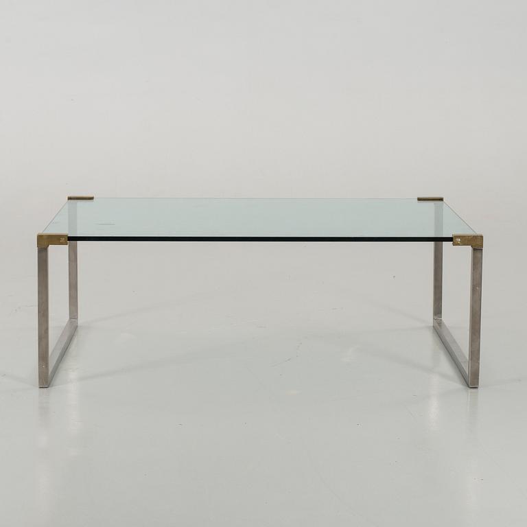 A GLASS TOP COFFEE TABLE SECOND HALF 20TH CENTURY.