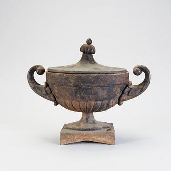 A 20th century cast iron urn.