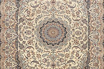 A carpet, Nain, part silk, approximately 348 x 258 cm.