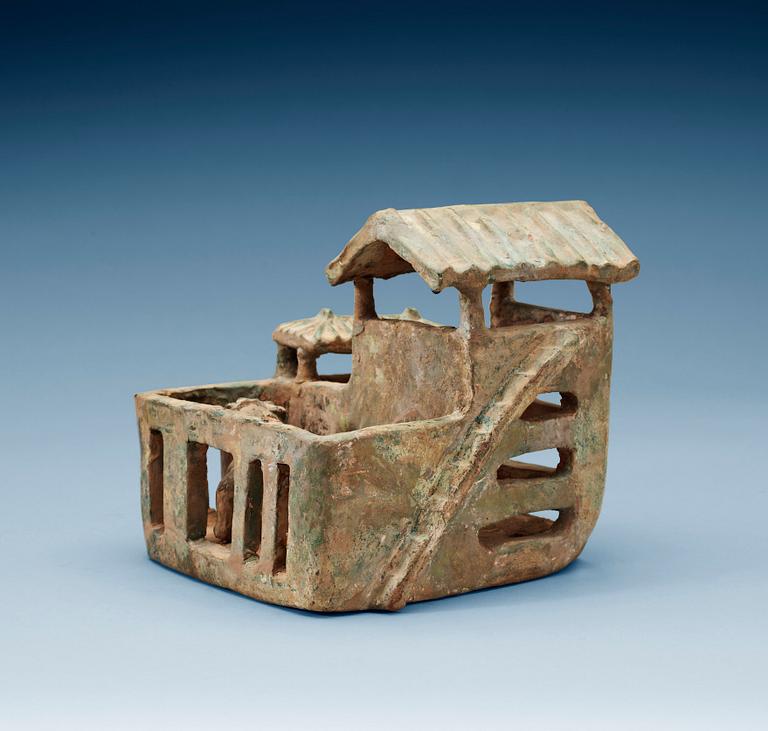 A green glazed pottery model of a house, Han dynasty (206 BC-220 AD).