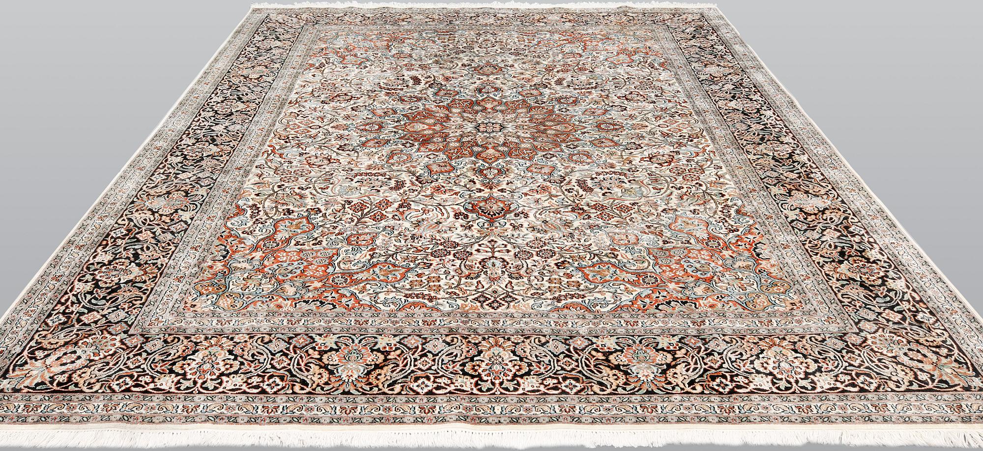 A silk Kashmir carpet, ca 330 x 246 cm.