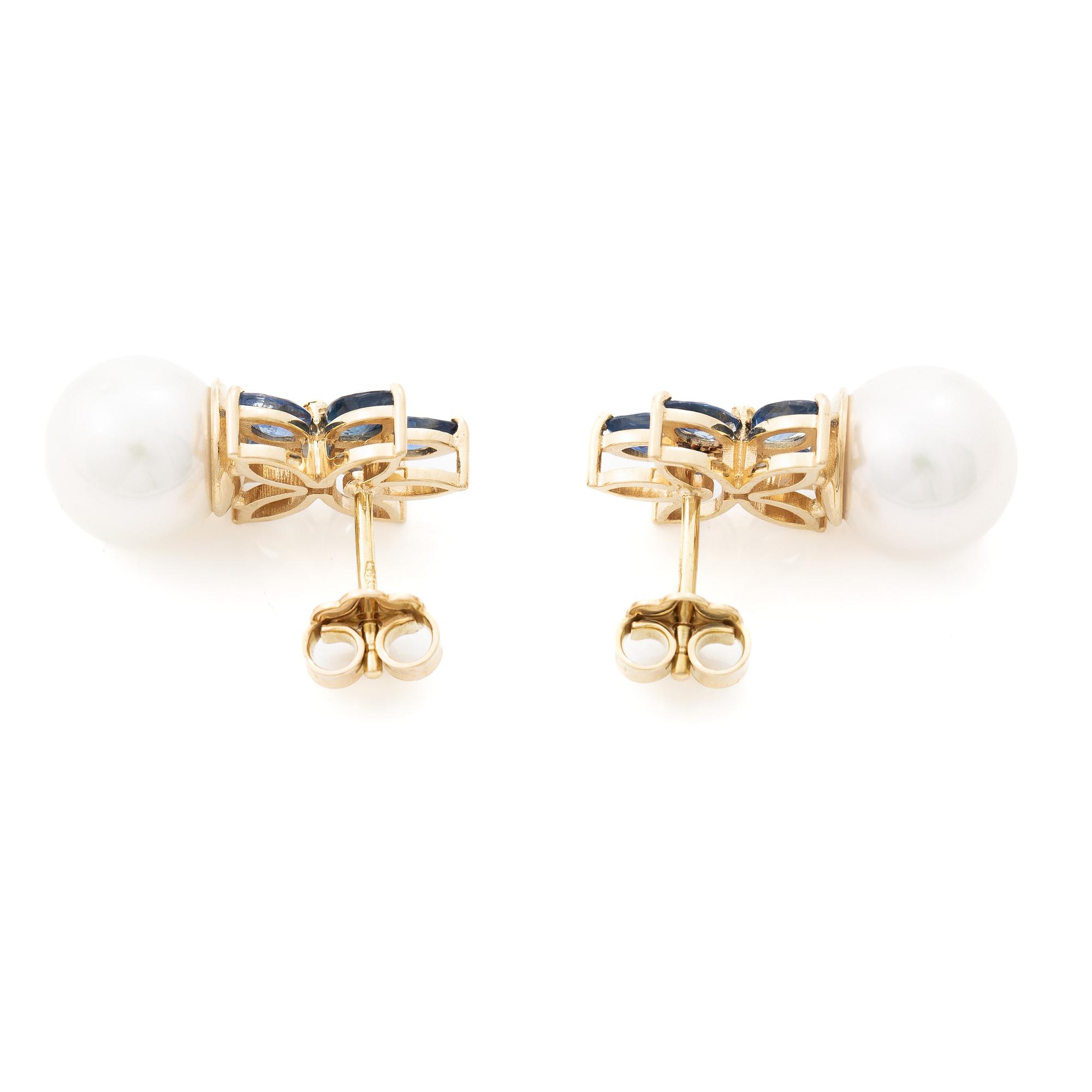 18K gold earrings with cultured Akoya pearls and navette-cut sapphires.