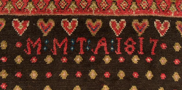 A Finnish folk art long pile ryijy-rug, dated 1817. Circa. 185 x 130 cm.