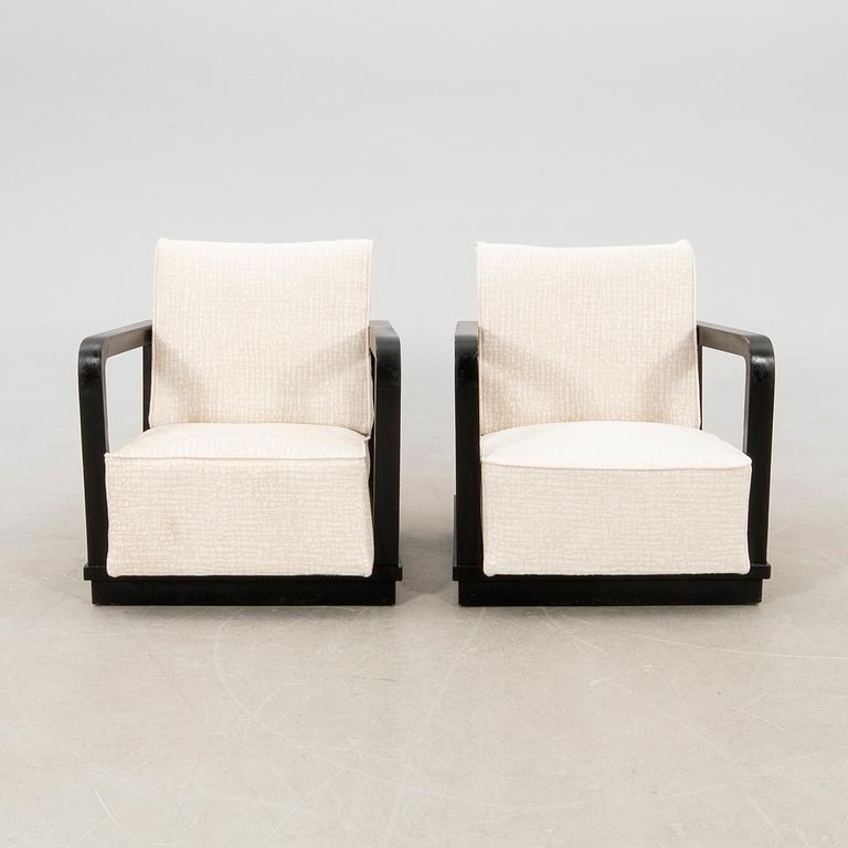 A pair of Art Deco armchairs.