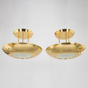 A pair of 1980s brass ceiling lights.