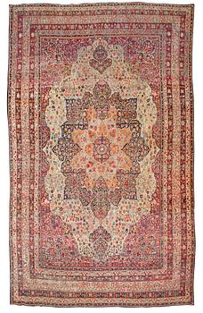 302. An antique Kerman Laver carpet, c. 586 x 385 cm.