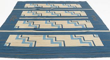 A flat weave carpet, Sweden, dated 1936, c. 370 x 260 cm.