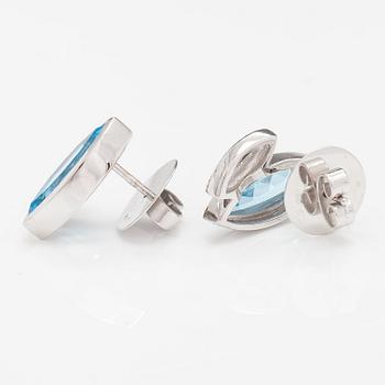 A pair of 14K white gold earrings with topazes and diamonds ca. 0.10 ct in total.
