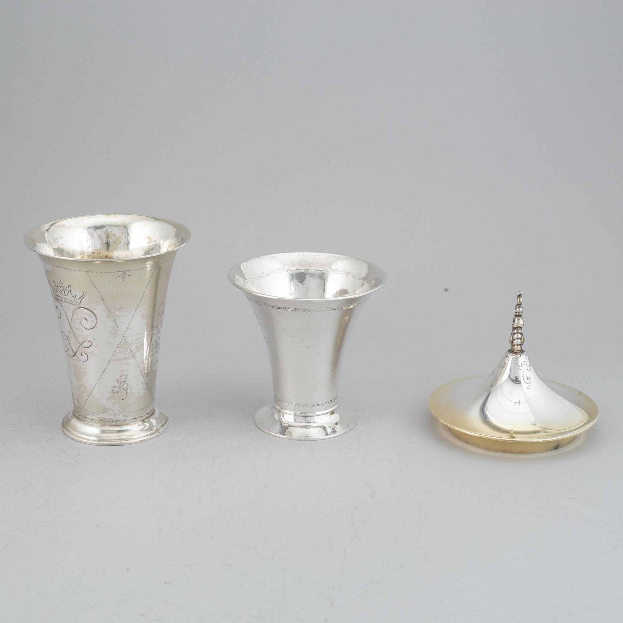 Two silver and parcel-gilt beakers and a parcel-gilt lid, maker's mark K. Andersson, Stockholm, 1927, 1922 and 1948.