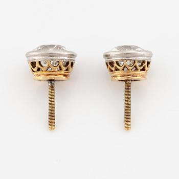 A pair of earrings in gold with old-cut diamonds.