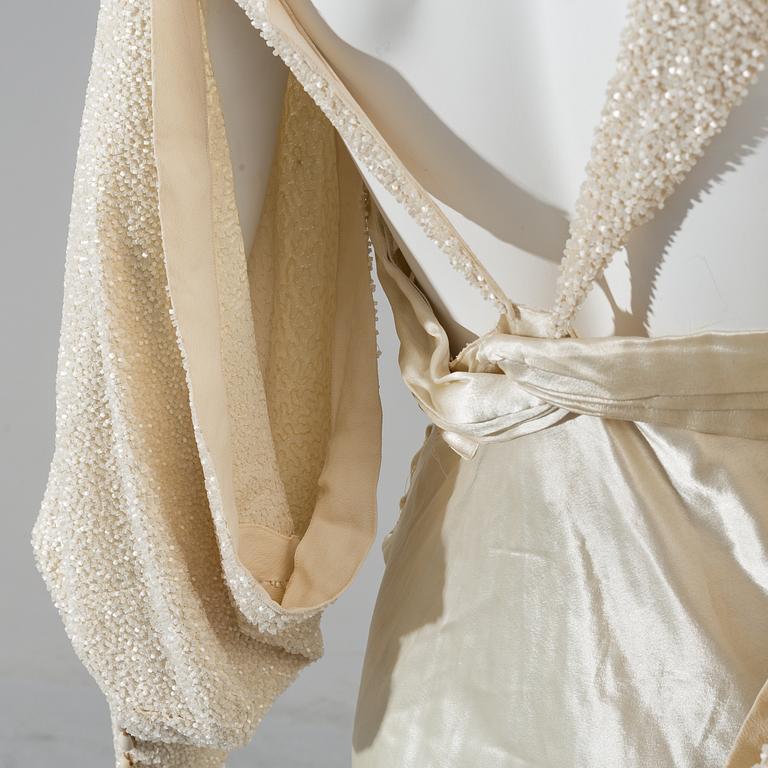 A satin wedding dress, circa 1935.