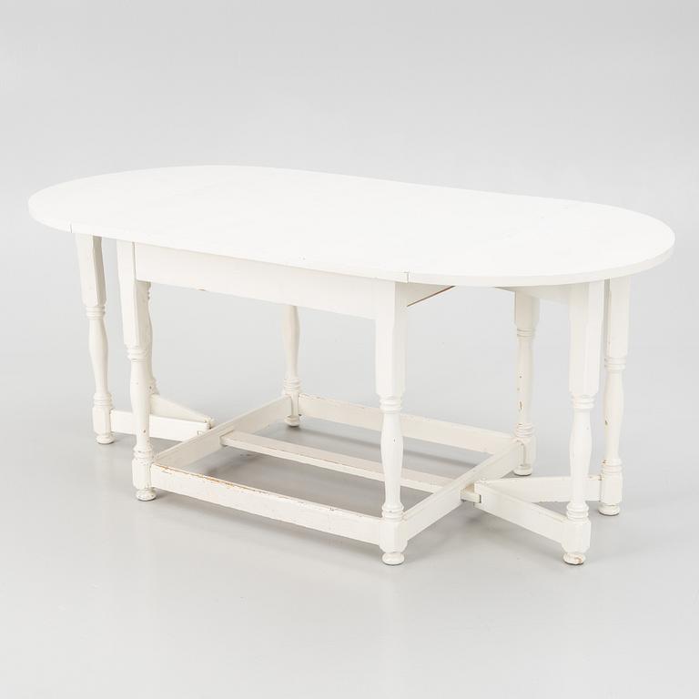 An early 20th century drop-leaf table.