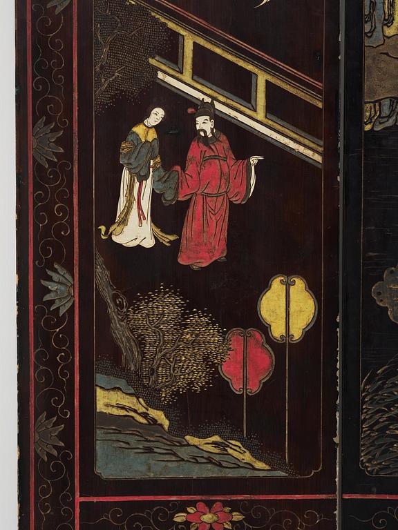 A Chinese four panel lacquer folding screen, first part of the 20th century.