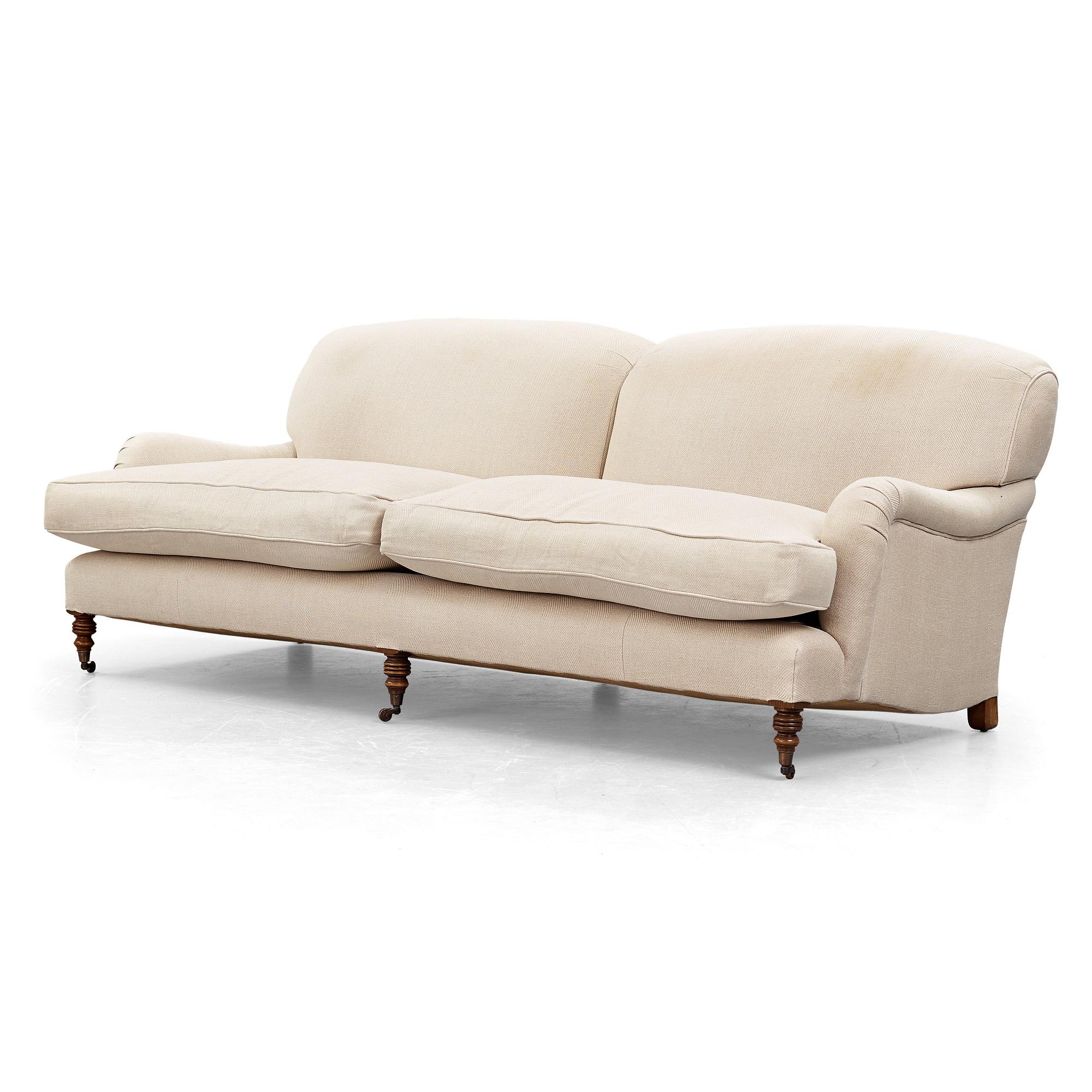 SOFA, "Howard", upholstered in an off-white fabric.