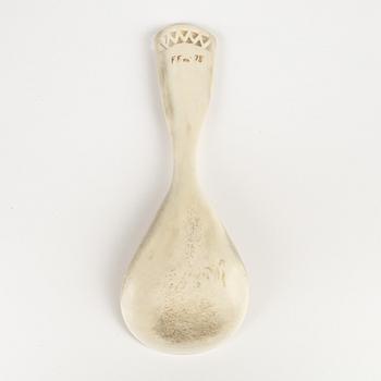 A horn spoon by Folke Fjällström, signed and dated -78.