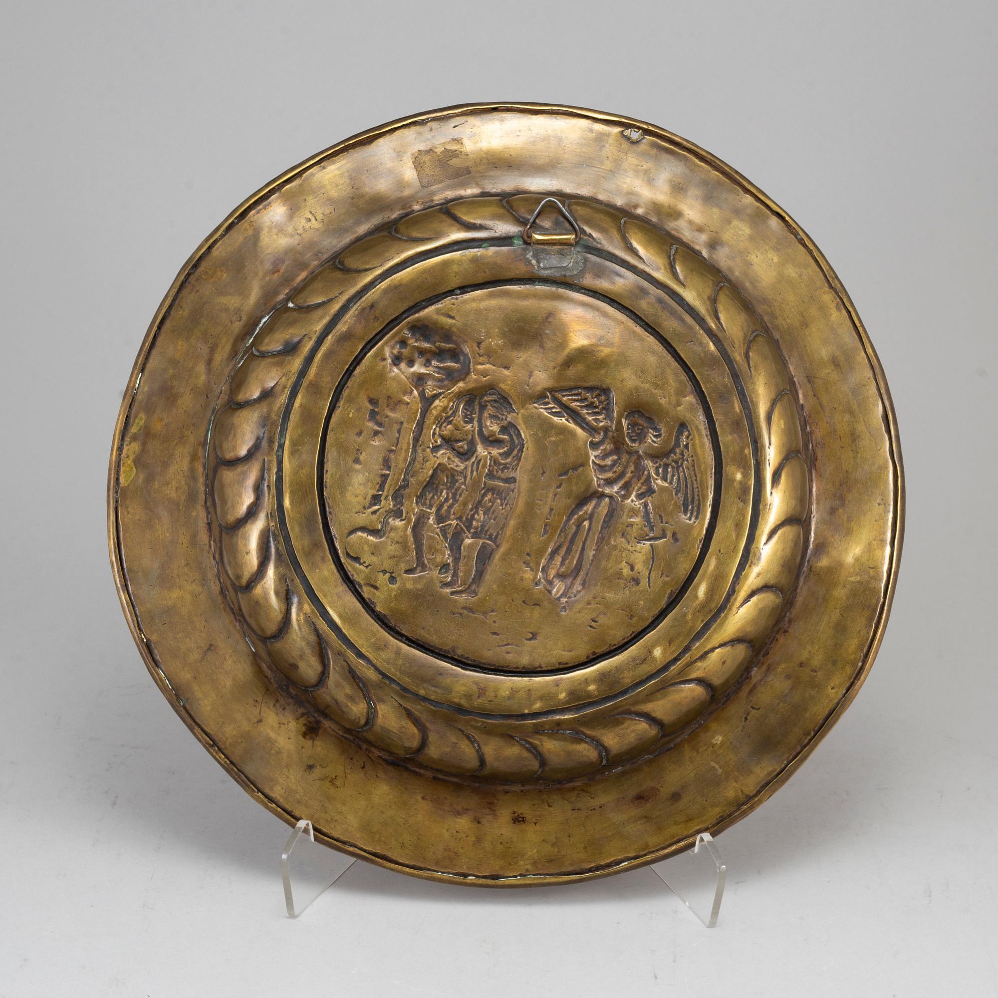 A renaissance style brass dish, late 19th century.