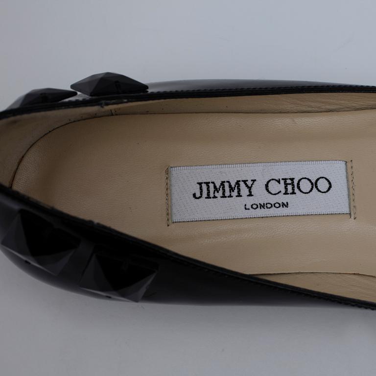 JIMMY CHOO, a pair of black ballerina shoes.