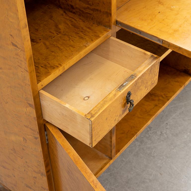 A 1930's birch veneered bookcase/sideboard.