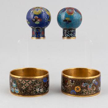 Two cloisonné cane tops and two napkin rings, China, first half of 20th Century.