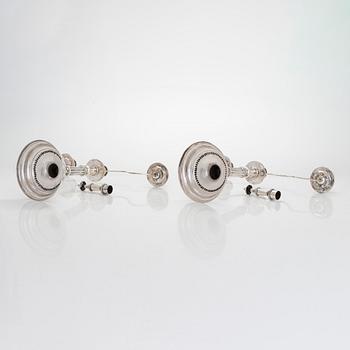 A pair of silver candelabra by Ferdinand Christian Krebs, Breslau, 1776-1792, with snuffers from Reval. Neo-classicism.